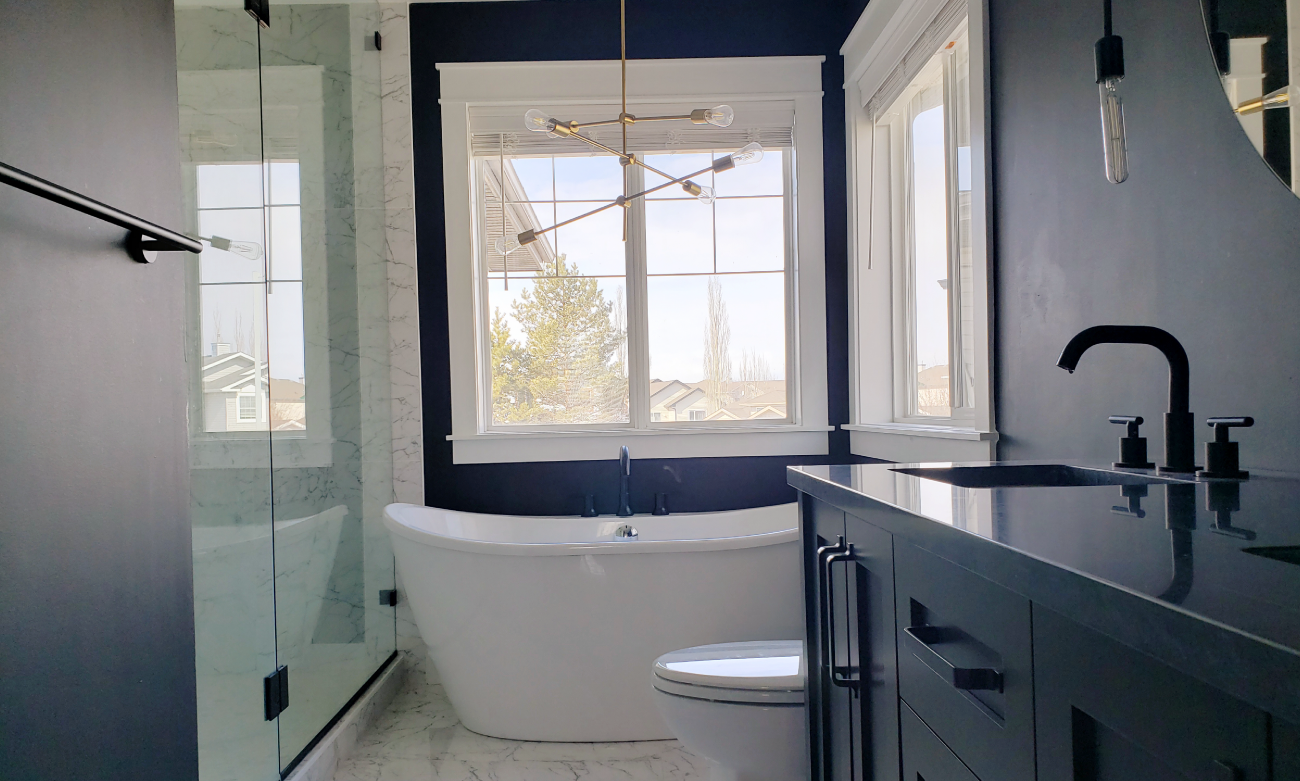 black bathroom renovation with marble
